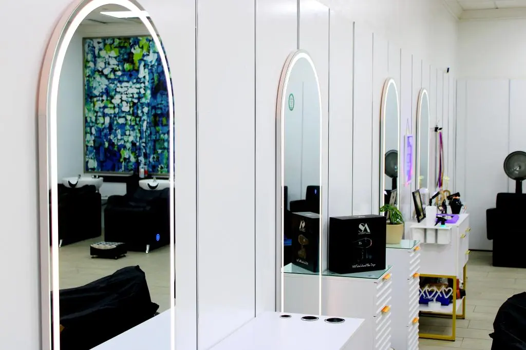 Skilled Hair Salon performing expert hair coloring treatment