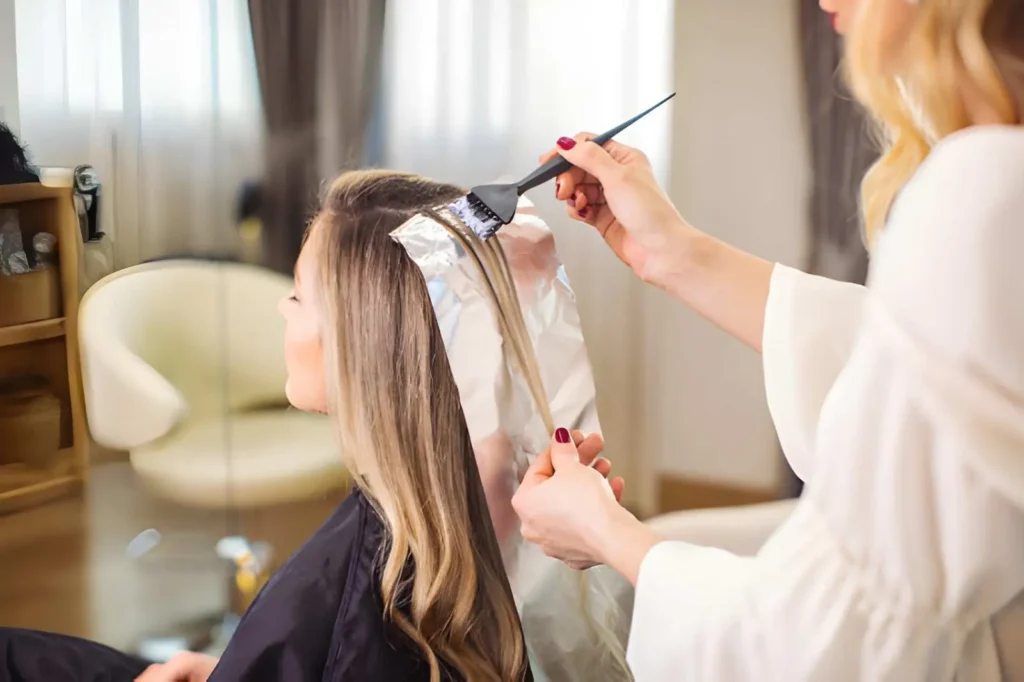 Professional Hair Colorist creating customized hair transformation for women
